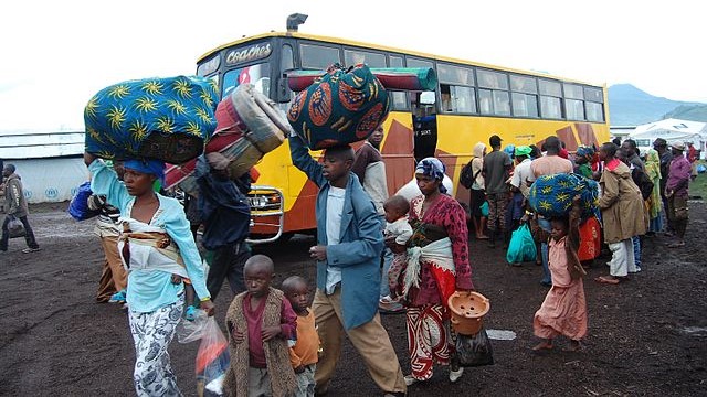 Refugees_in_transit_from_the_border_with_DRC_to_Rwamwanja,_Uganda_(9086821264)