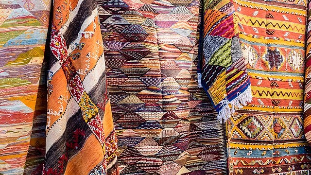 Rugs displayed at the streets of Fez Souks Morocco (16638732987)
